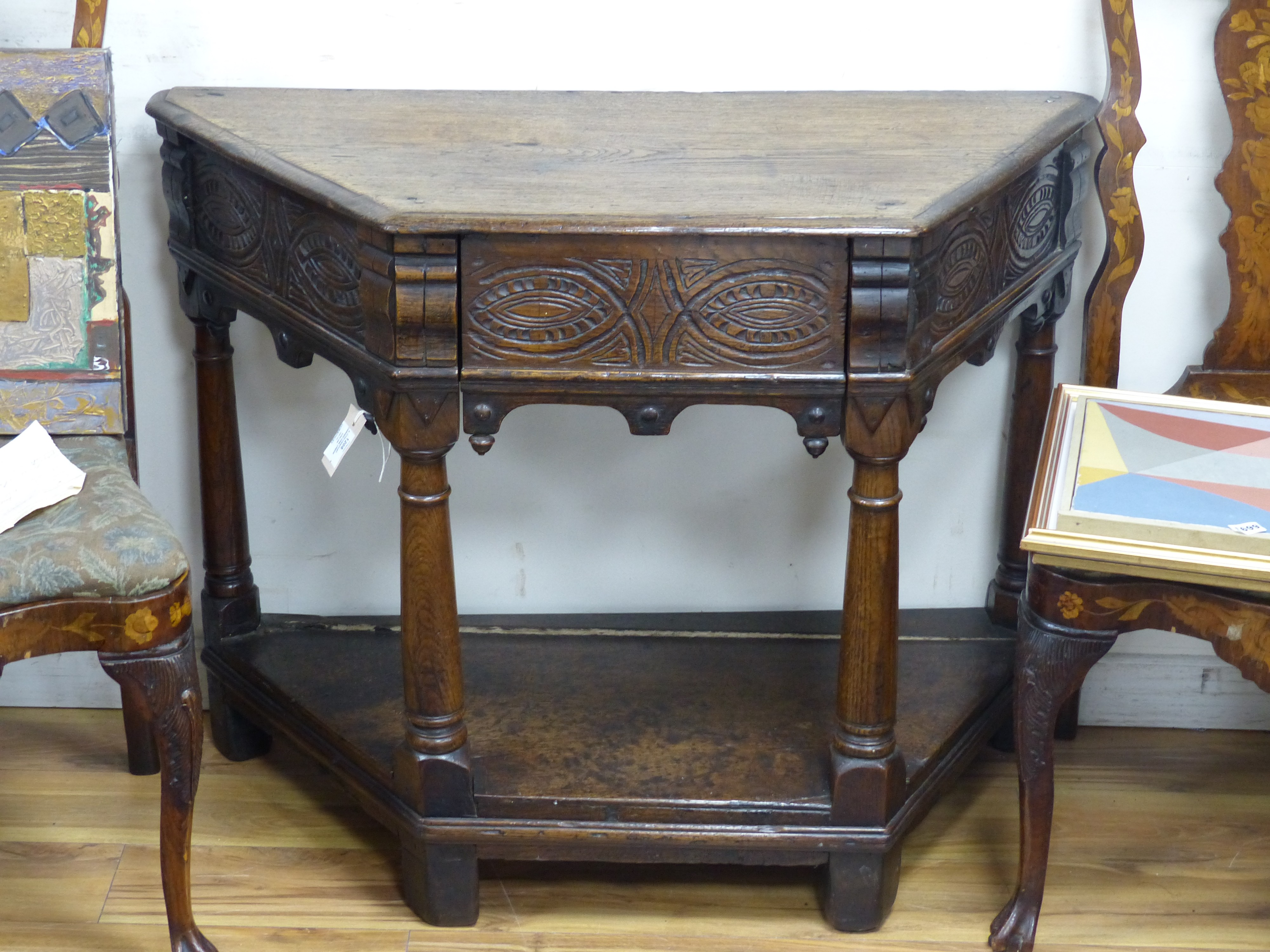 A 17th century carved oak credence type table (faults), width 104cm, depth 46cm, height 81cm